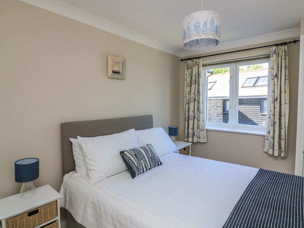A bedroom with a bed and window at 6 Dartmouth House in Dartmouth