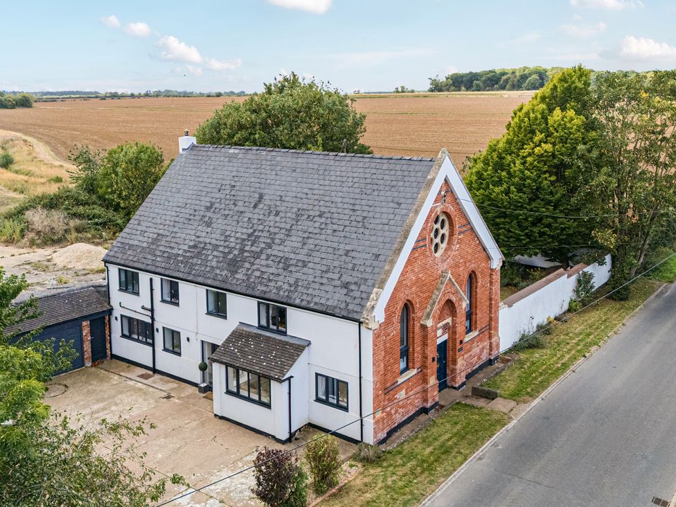 A house with a driveway and trees at The Old Chapel in Glentworth near Ingham