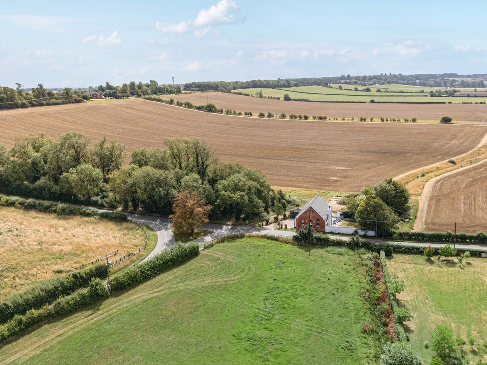 A house surrounded by fields and trees at The Old Chapel in Glentworth near Ingham