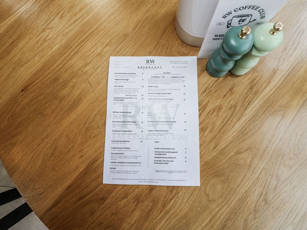 A menu on a table with salt and pepper shakers at RW Coffee Club in South Luffenham near Edith Weston