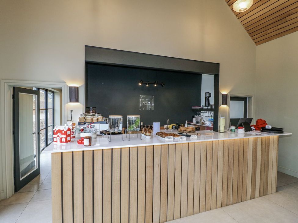 A cafe counter with food and drinks at Badger's Burrow in Edith Weston