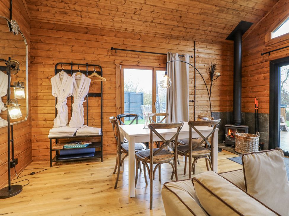 A dining room with a table and chairs at Rabbit Hole near Stamford