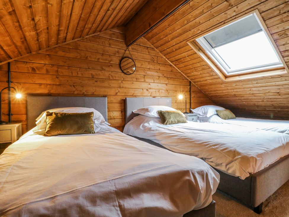 A bedroom with two beds and a skylight at Rabbit Hole near Stamford