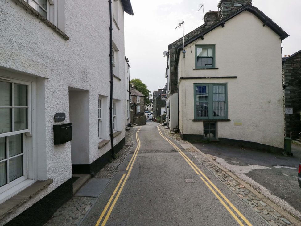 A street with houses and a mailbox at Unicorn Cottage in 