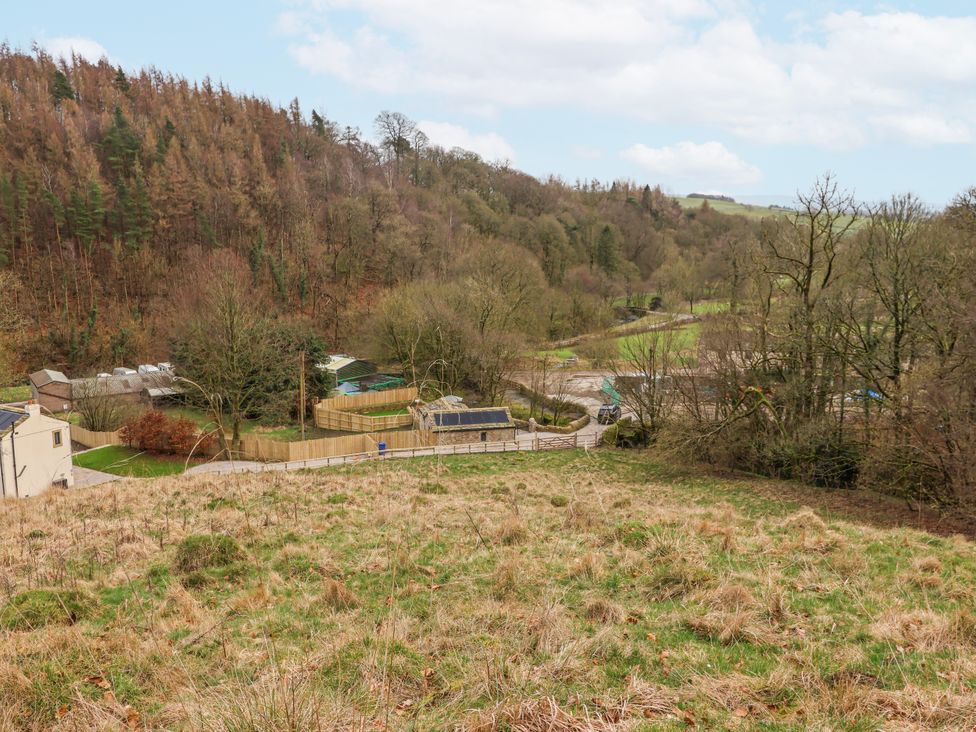 A landscape view with trees and buildings in the distance at Beckside, Skipton