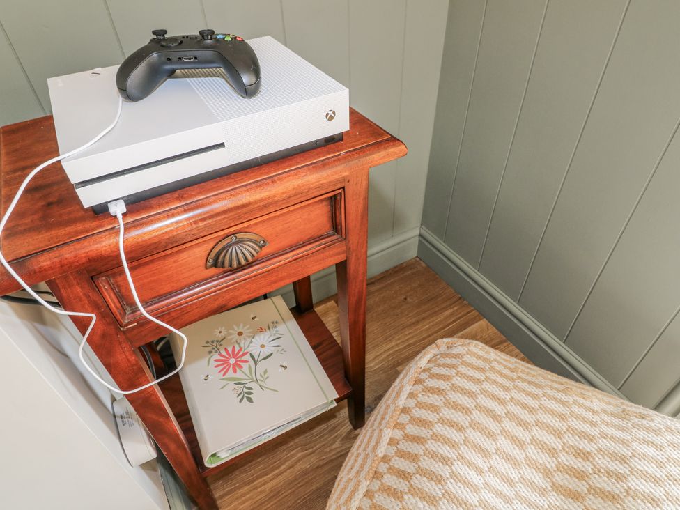 A snug with an xbox console and controller on a nightstand at 6 Pine Walk in Uttoxeter