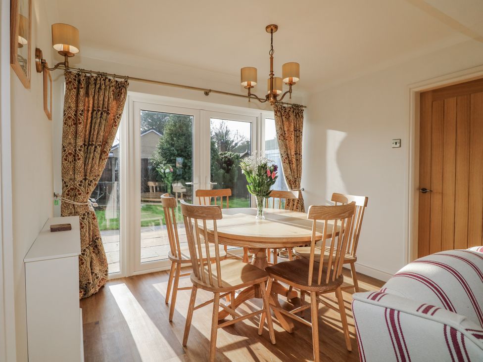 A dining room with a table and chairs at 6 Pine Walk Uttoxeter