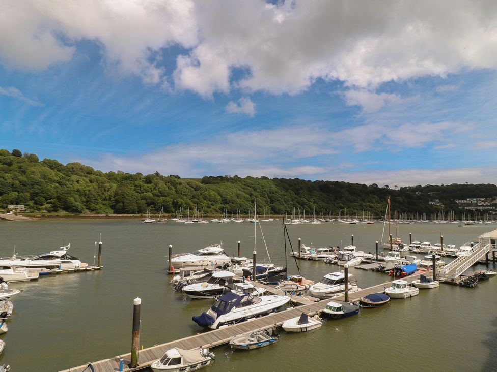 A marina with boats and a dock at 22 Dart Marina Dartmouth