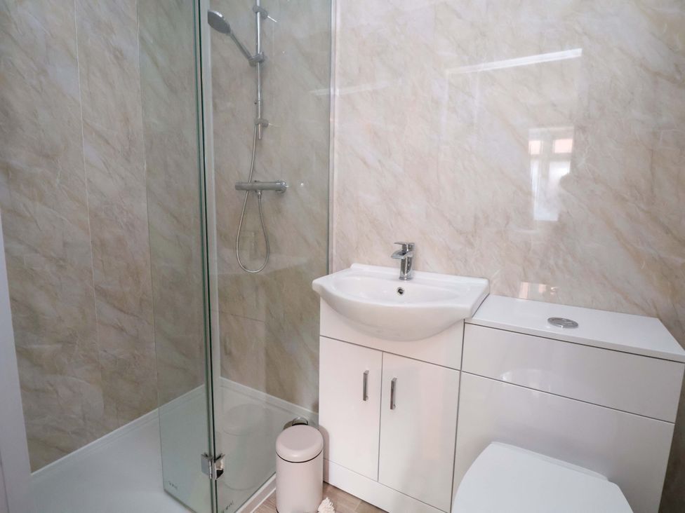 A bathroom with a shower and sink at The Old Barn in Pentre Celyn