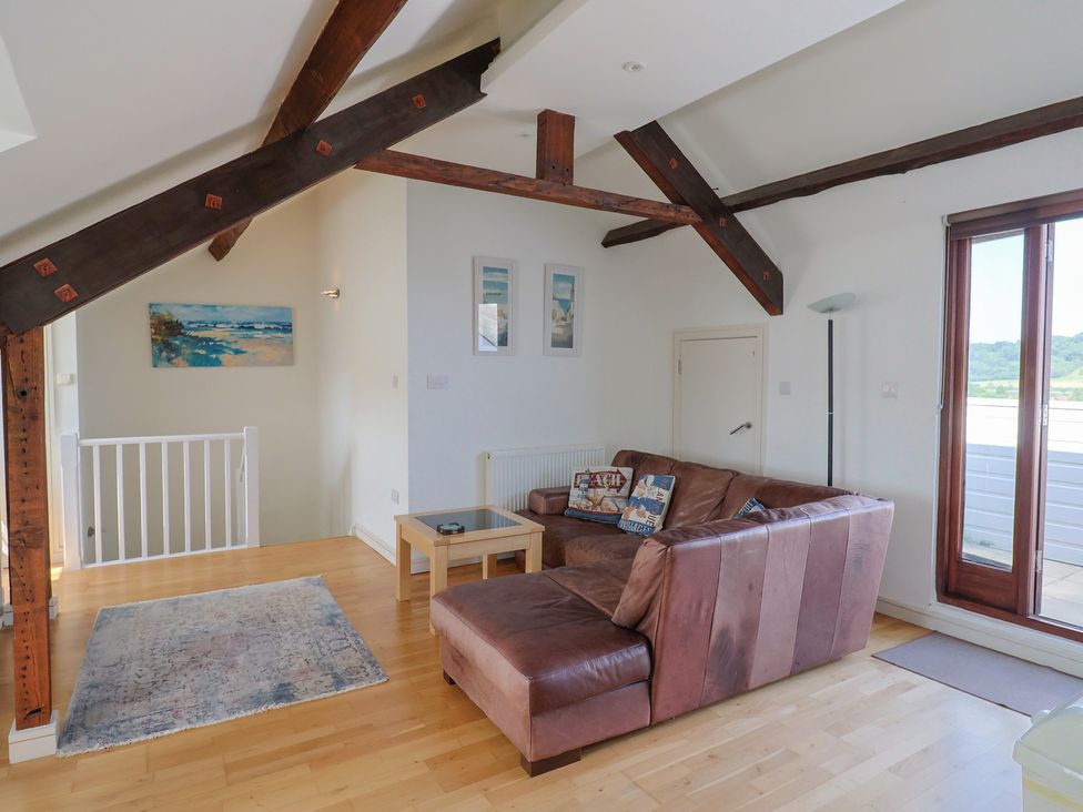 A living room with a sofa and coffee table at Cliff View in Seaton