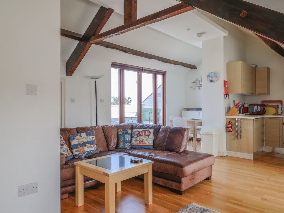 A living room with a sofa and a coffee table at Cliff View in Seaton