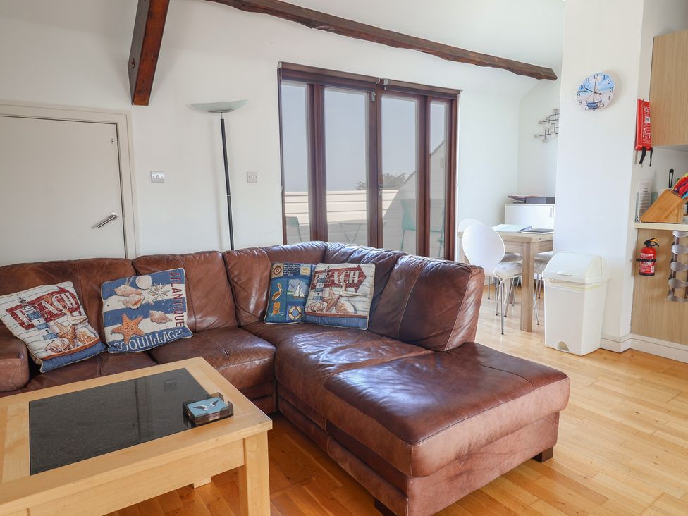 A living room with a sofa and coffee table at Cliff View in Seaton