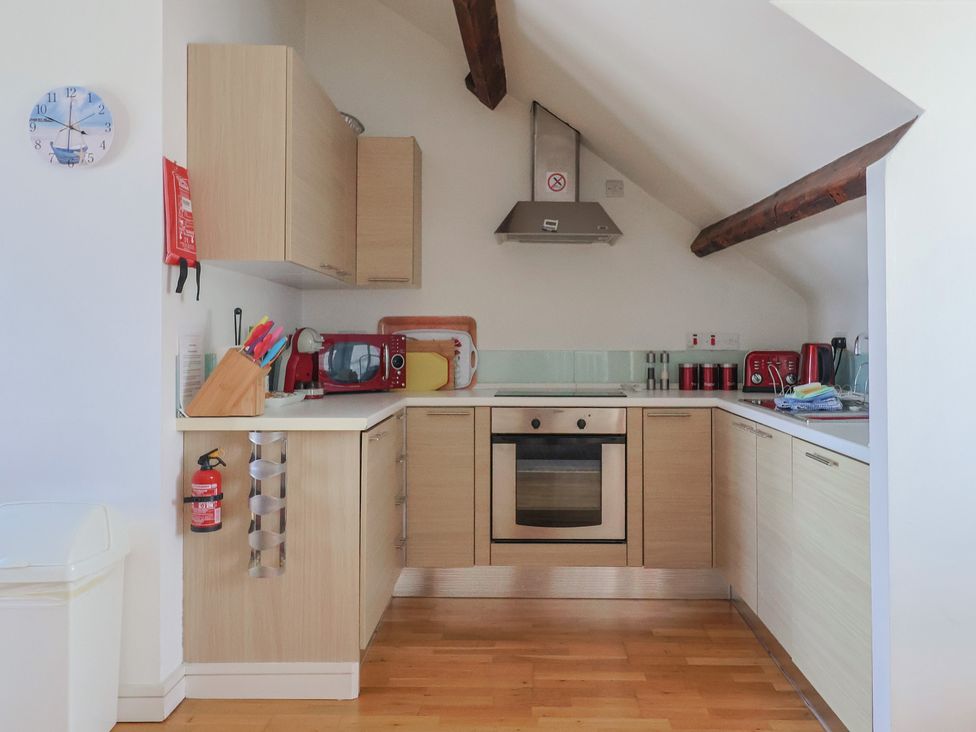 A kitchen with an oven, sink and various appliances at Cliff View in Seaton