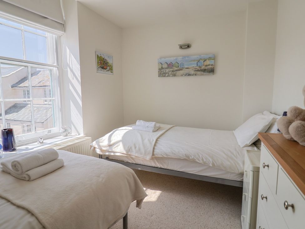 A bedroom with a bed and a window at Cliff View in Seaton