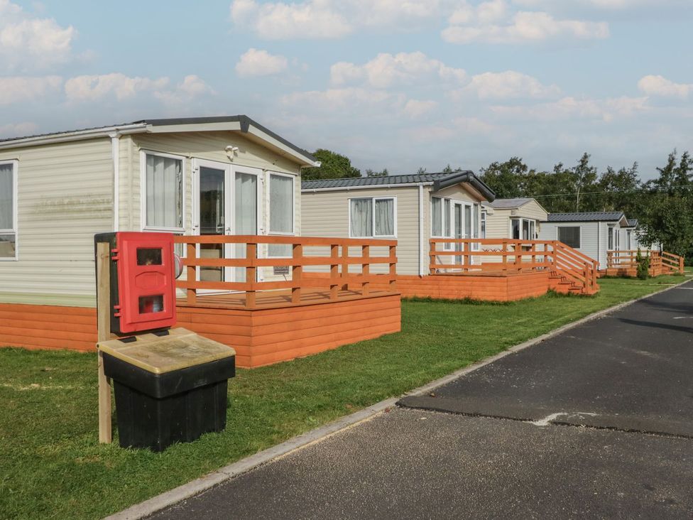 Caravans with porches and a mailbox at Ash in Denny