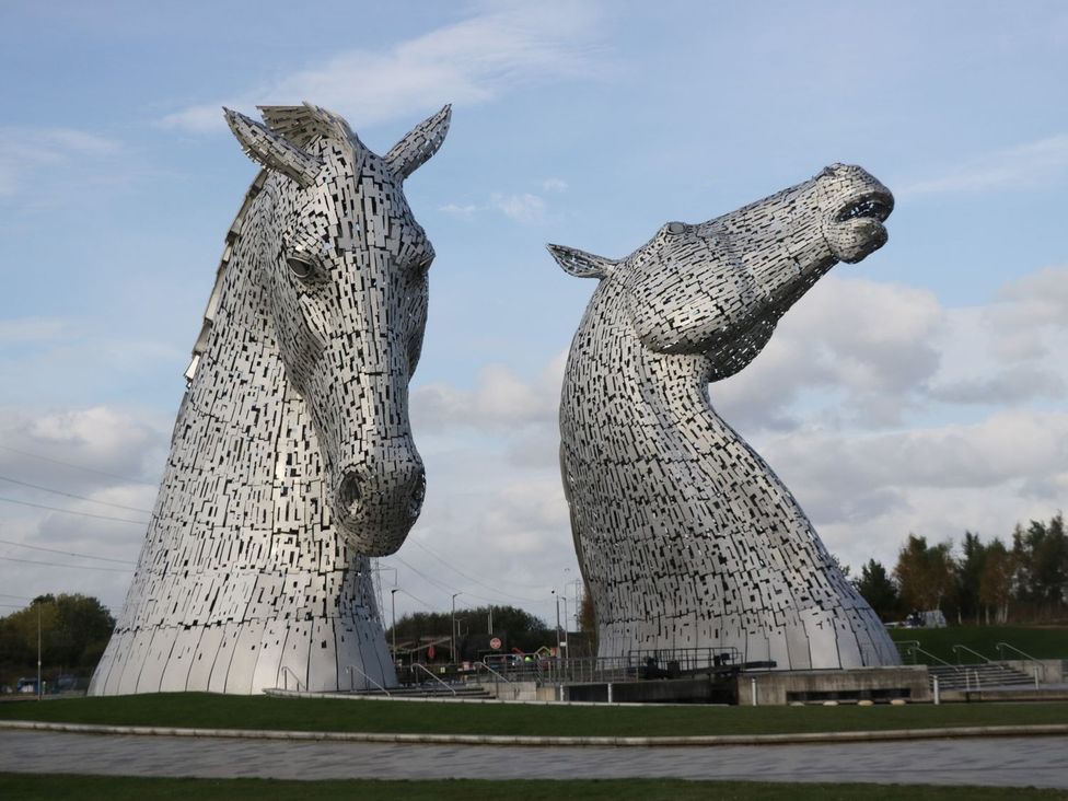 Two large horse sculptures in a park at Ash Denny