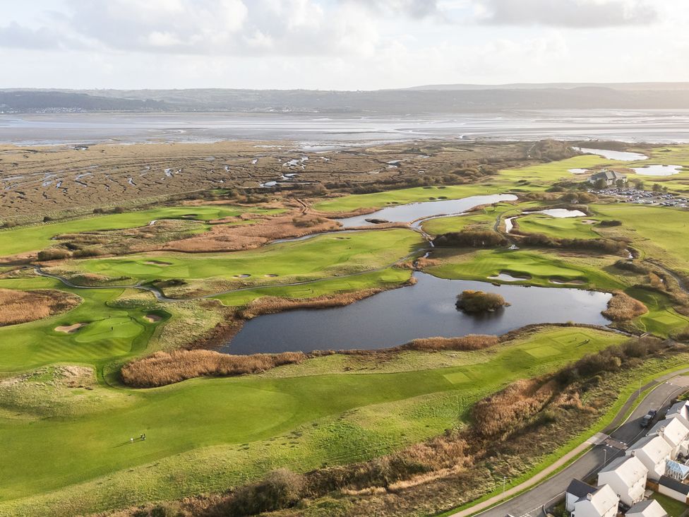 A golf course with water bodies and houses at 69 Ffordd Y Meillion, Llanelli