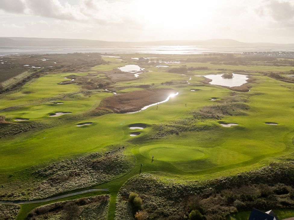 A golf course with several holes and water hazards at 69 Ffordd Y Meillion in Llanelli