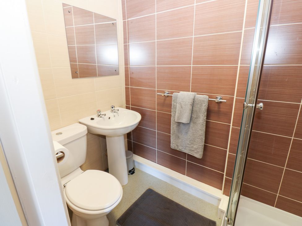 A bathroom with a toilet and sink at Bedroom 3 in Bishop Auckland