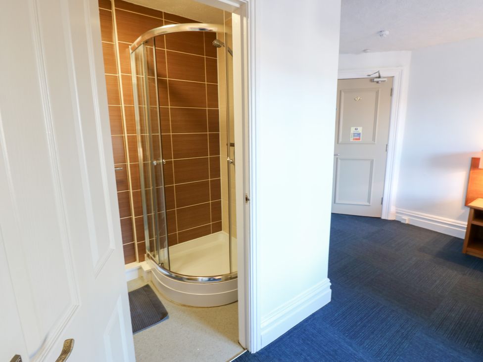 A bathroom with shower and internal door at Bedroom 3 Bishop Auckland