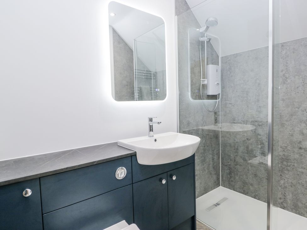 A bathroom with a sink and shower at Claife Flights Bowness-On-Windermere