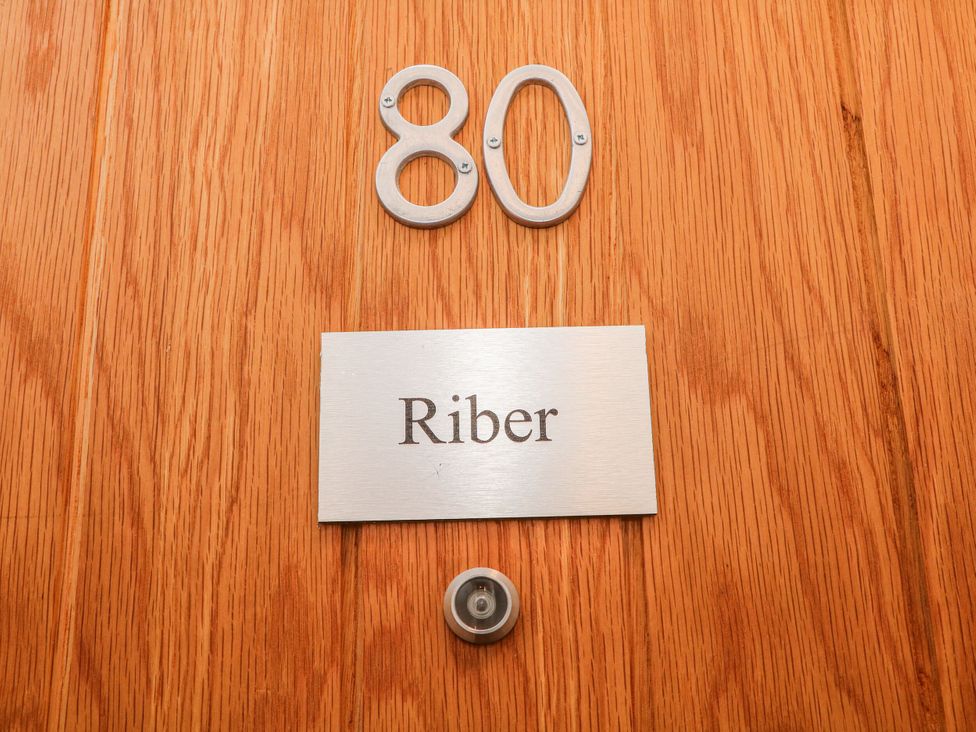 An entryway featuring a door with the number 80 and a nameplate 'Riber' at Riber, Matlock Bath