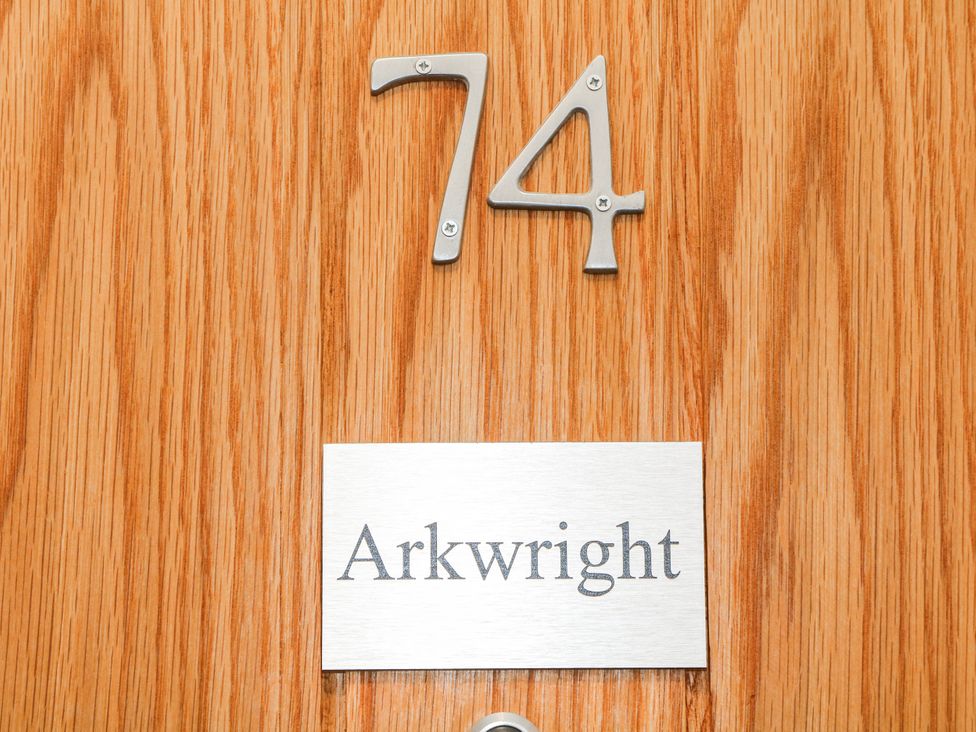 A door with number 74 and nameplate Arkwright