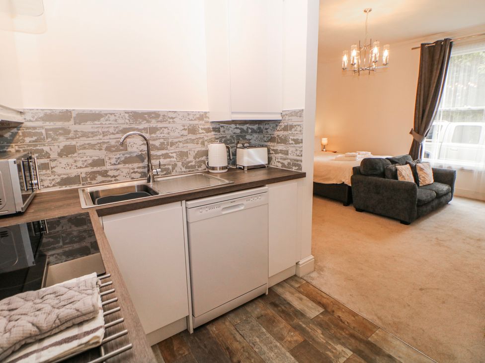 A kitchen with sink and appliances at Arkwright in Matlock
