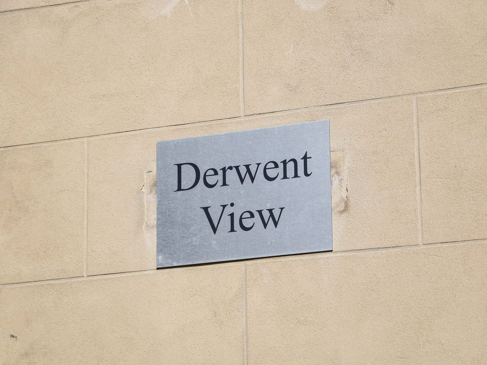 A sign with the name Derwent View on a wall at Lumsdale Matlock Bath