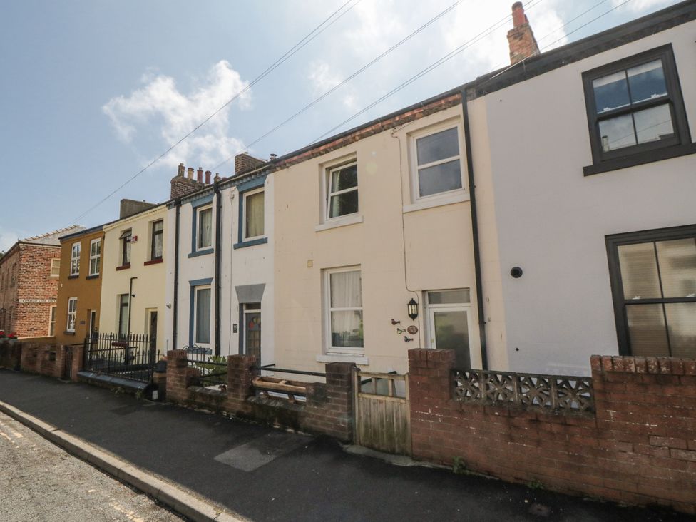 A row of houses with a fence in Number 33 Scarborough