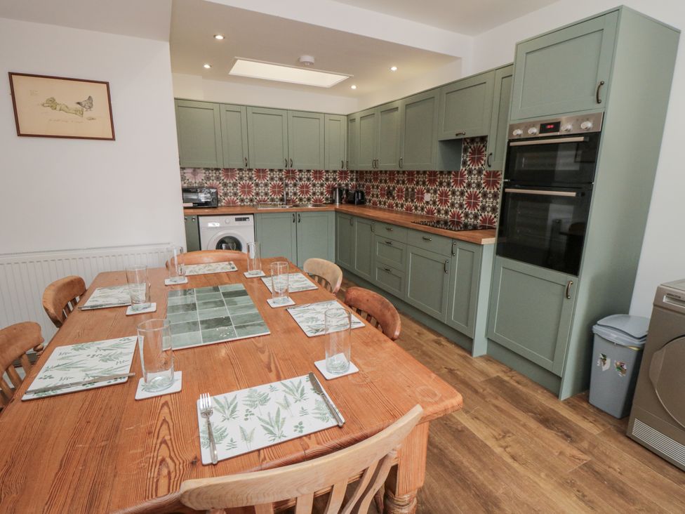 A kitchen with a dining table and chairs at Number 33 in Scarborough