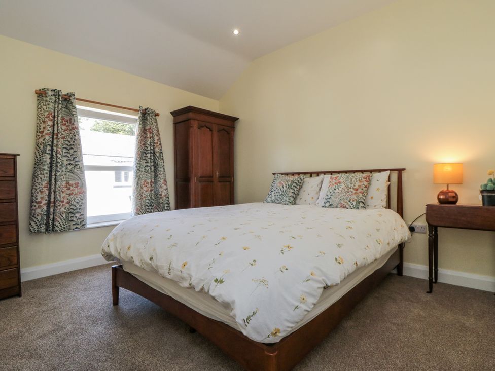 A bedroom with a bed and wardrobe at Number 33 in Scarborough
