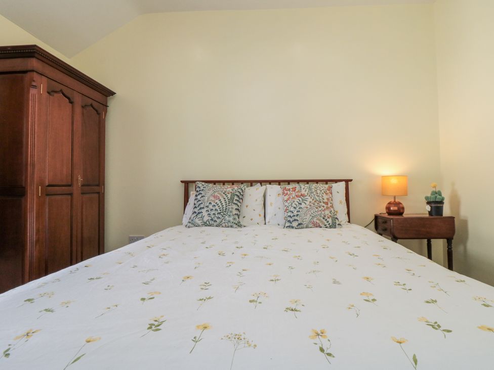 A bedroom with a bed and nightstand at Number 33 in Scarborough