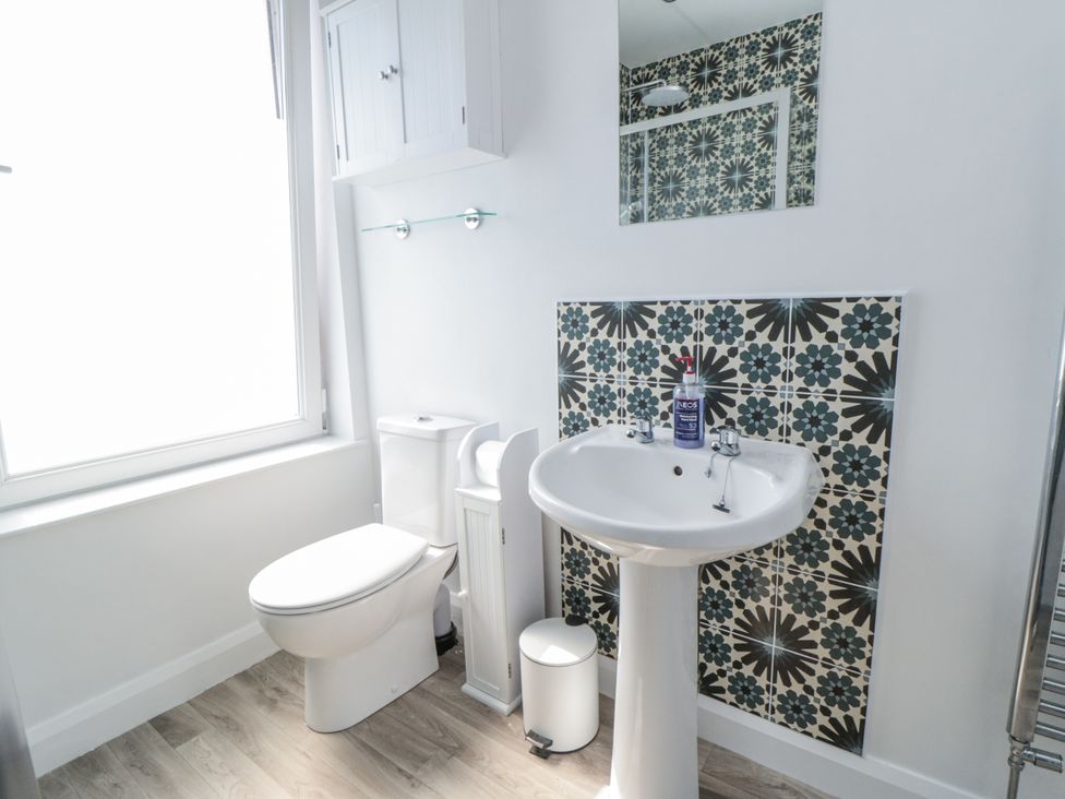 A bathroom with toilet and sink at Number 33 Scarborough