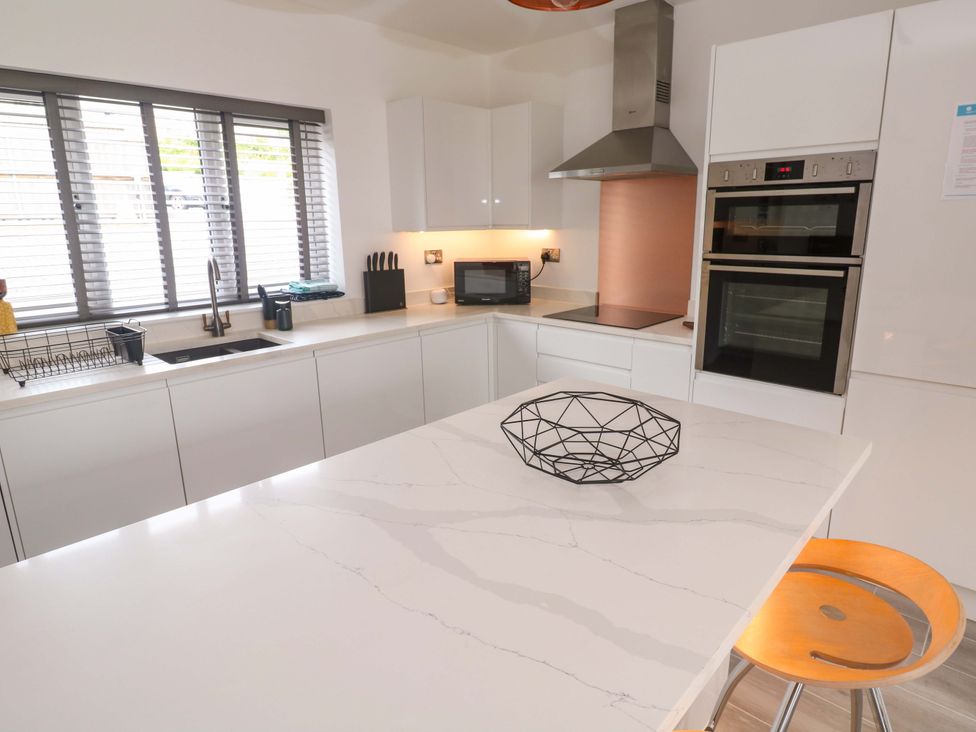 A kitchen with modern appliances and a countertop at Miramar St. Ives