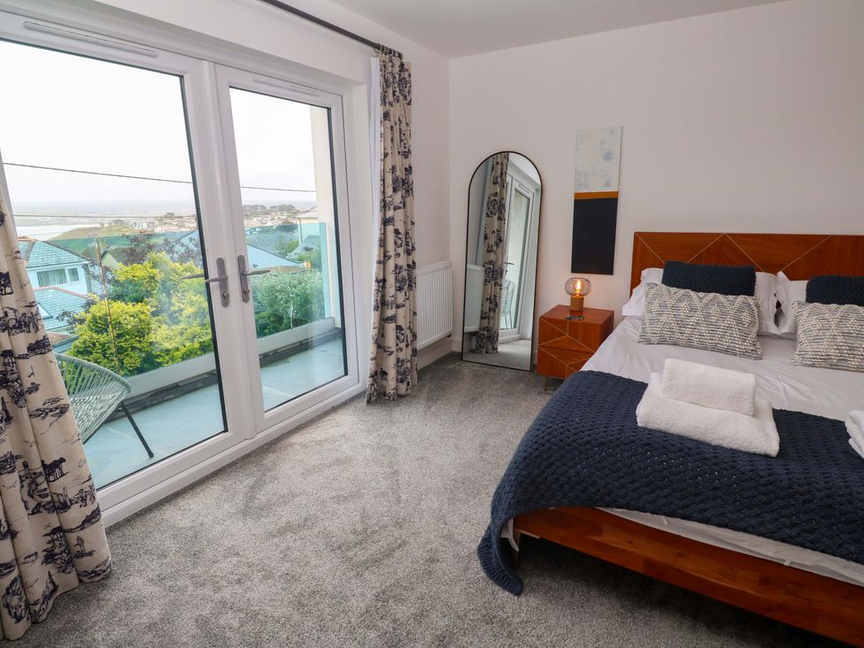 A bedroom with a bed and nightstand at Miramar in St. Ives