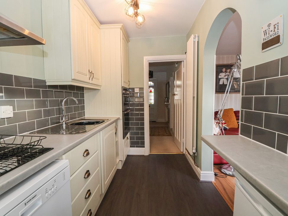 A kitchen with sink and cabinets at 57 Broadway West Chester