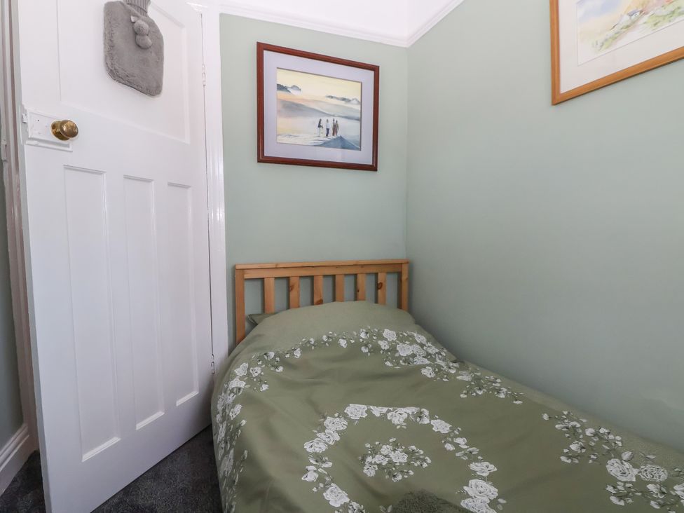 A bedroom with a bed and artwork on the wall at 57 Broadway West Chester