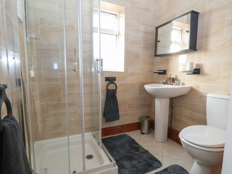A bathroom with shower, sink, and toilet at 57 Broadway West Chester