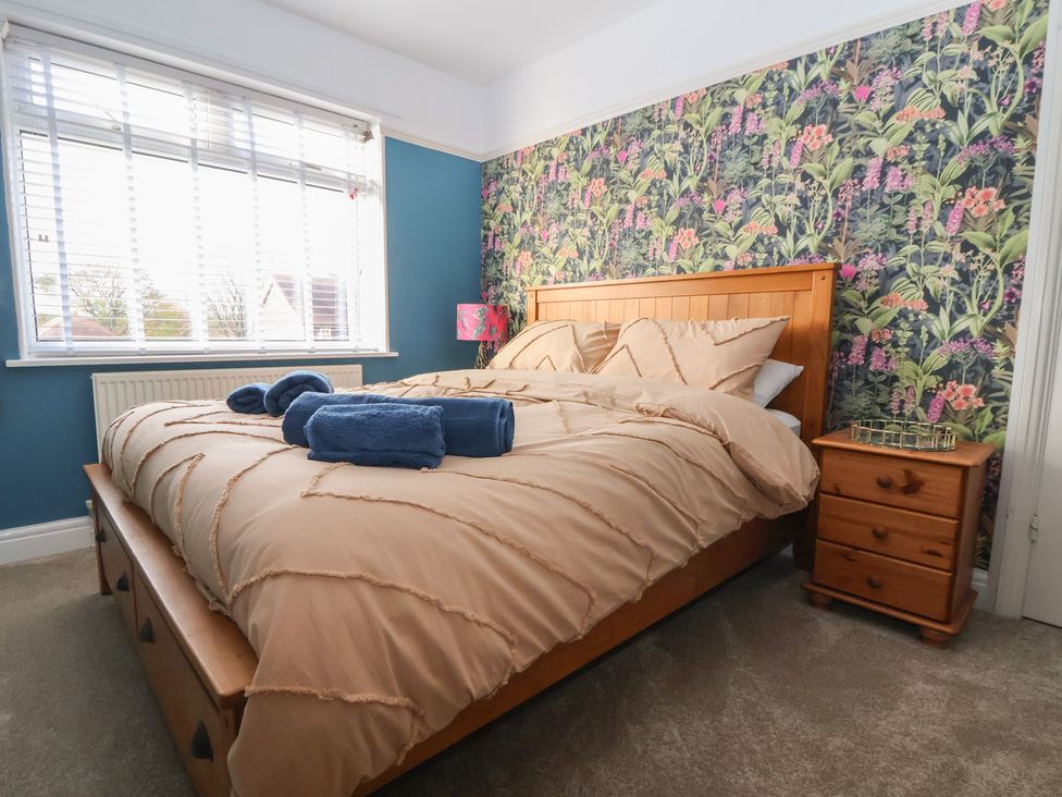 A bedroom with a bed and nightstand at 57 Broadway West in Chester