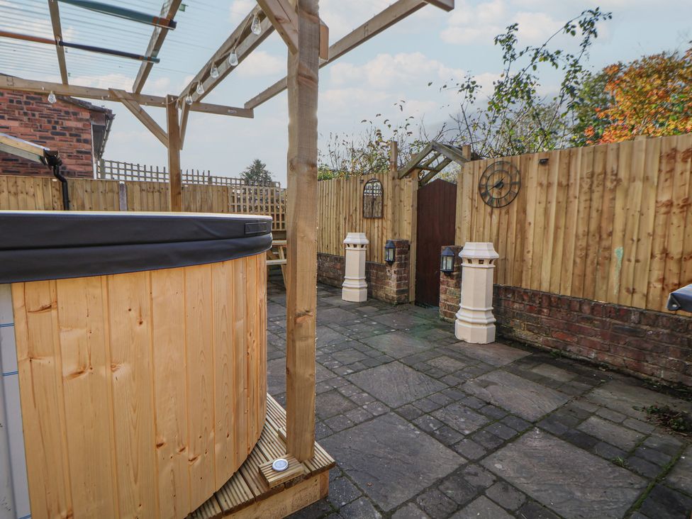 A garden with a hot tub and stone paving at 57 Broadway West Chester