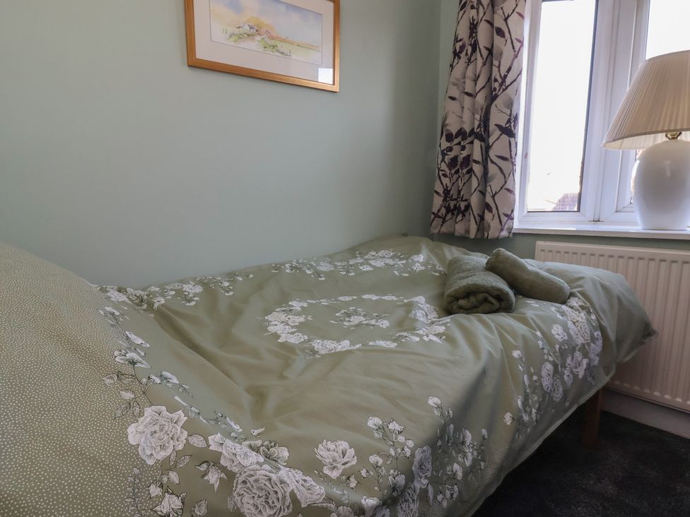 A bedroom with a bed and window at 57 Broadway West Chester