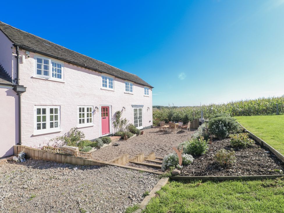 A house with a garden and seating area at Gapstile in Abbots Bromley