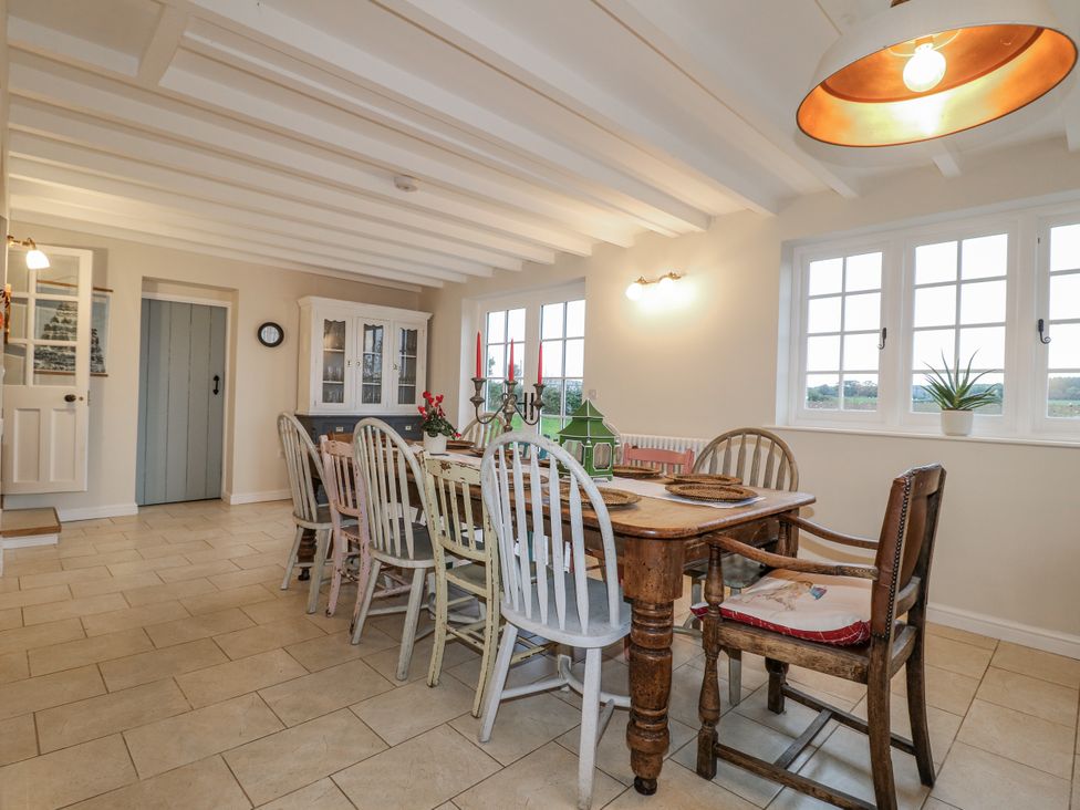 A dining room with a table and chairs at Gapstile in Abbots Bromley