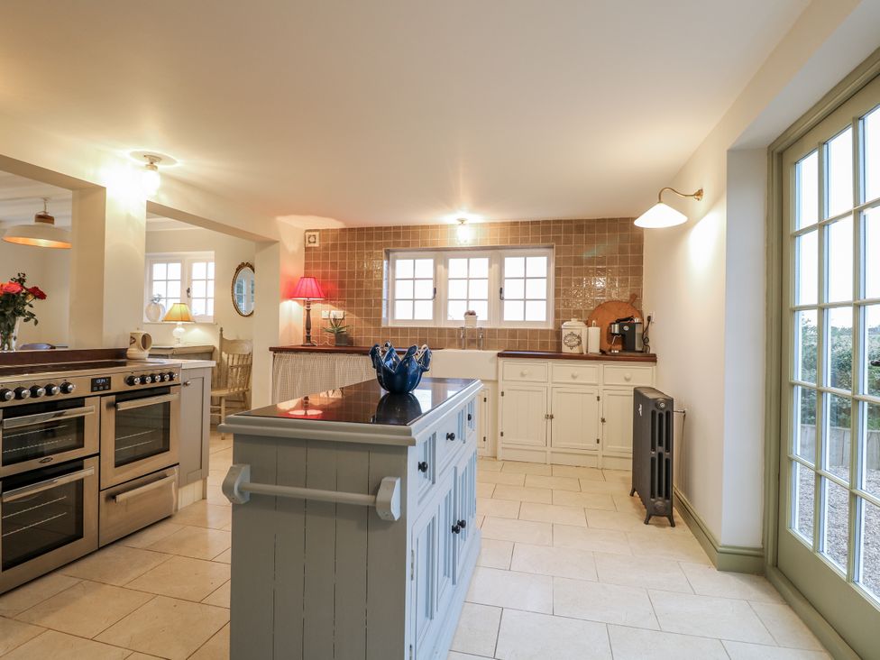 A kitchen with modern appliances and a large island at Gapstile in Abbots Bromley