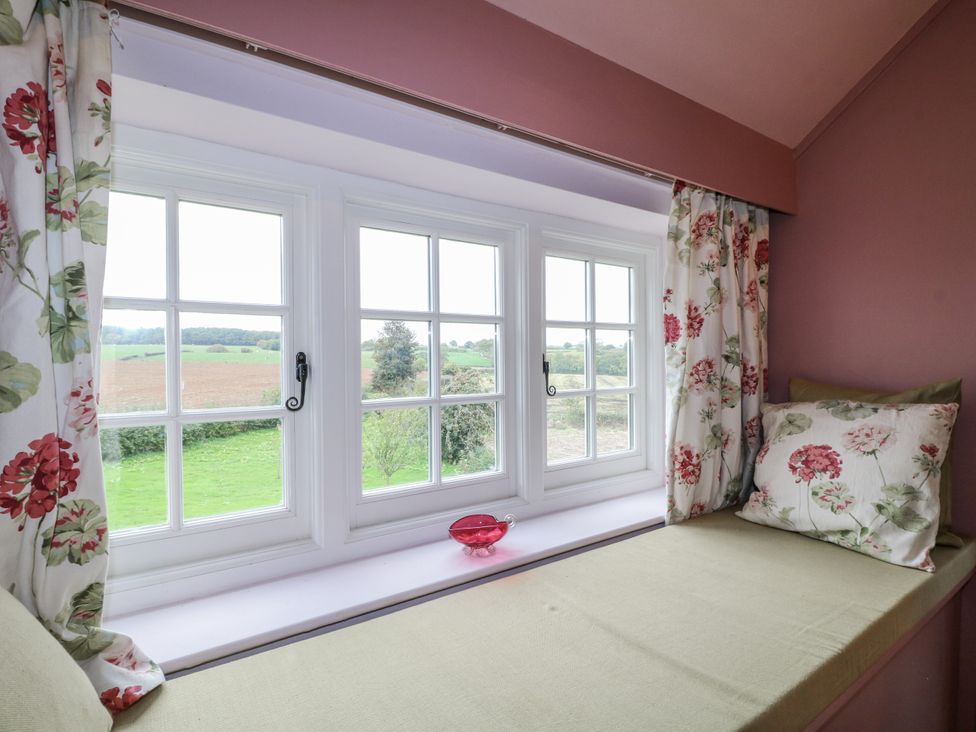 A snug with a window seat and view at Gapstile in Abbots Bromley