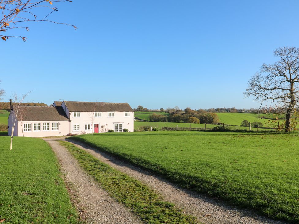 A house with a driveway and fields at Gapstile in Abbots Bromley
