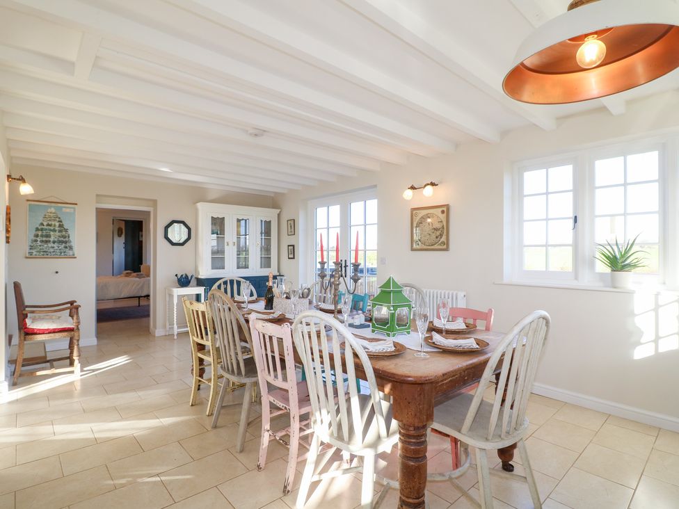 A dining room with a table and chairs at Gapstile in Abbots Bromley