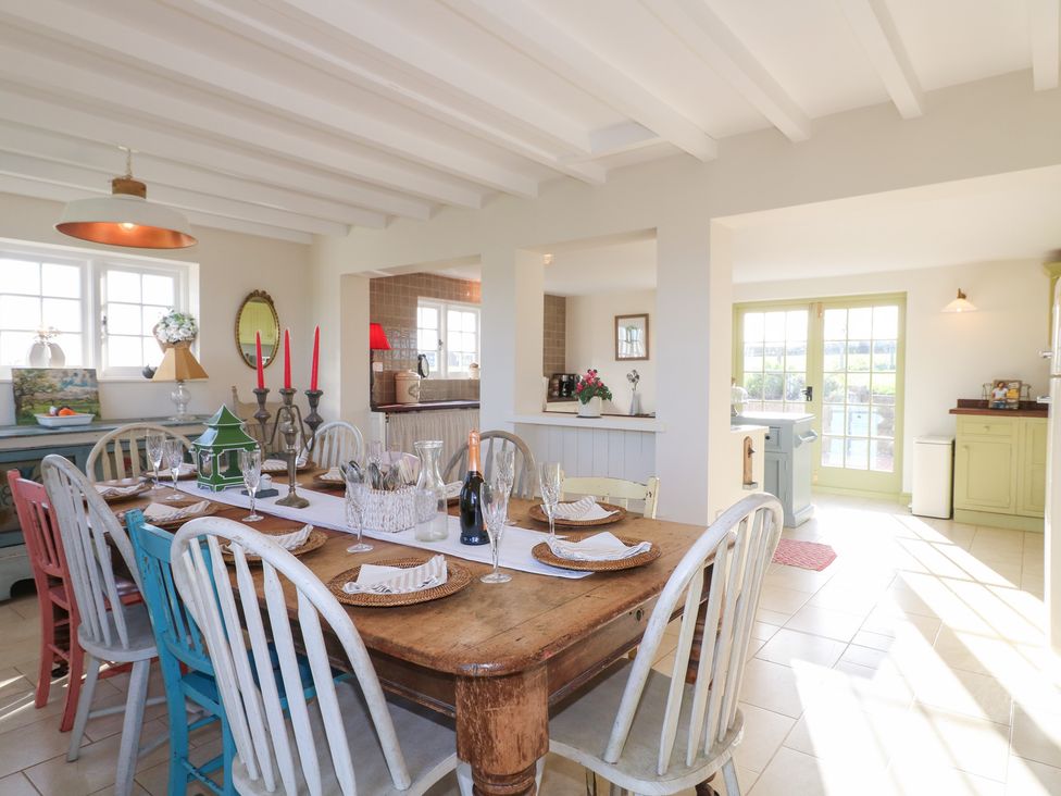 A dining room with a wooden table and chairs at Gapstile in Abbots Bromley