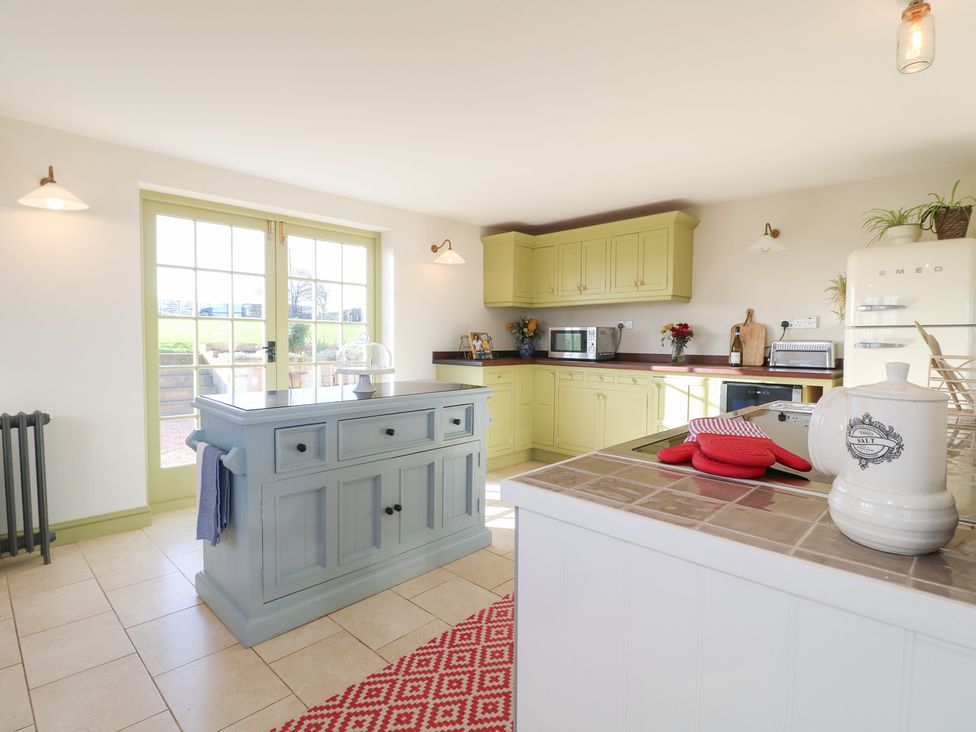 A kitchen with cabinets and appliances at Gapstile in Abbots Bromley